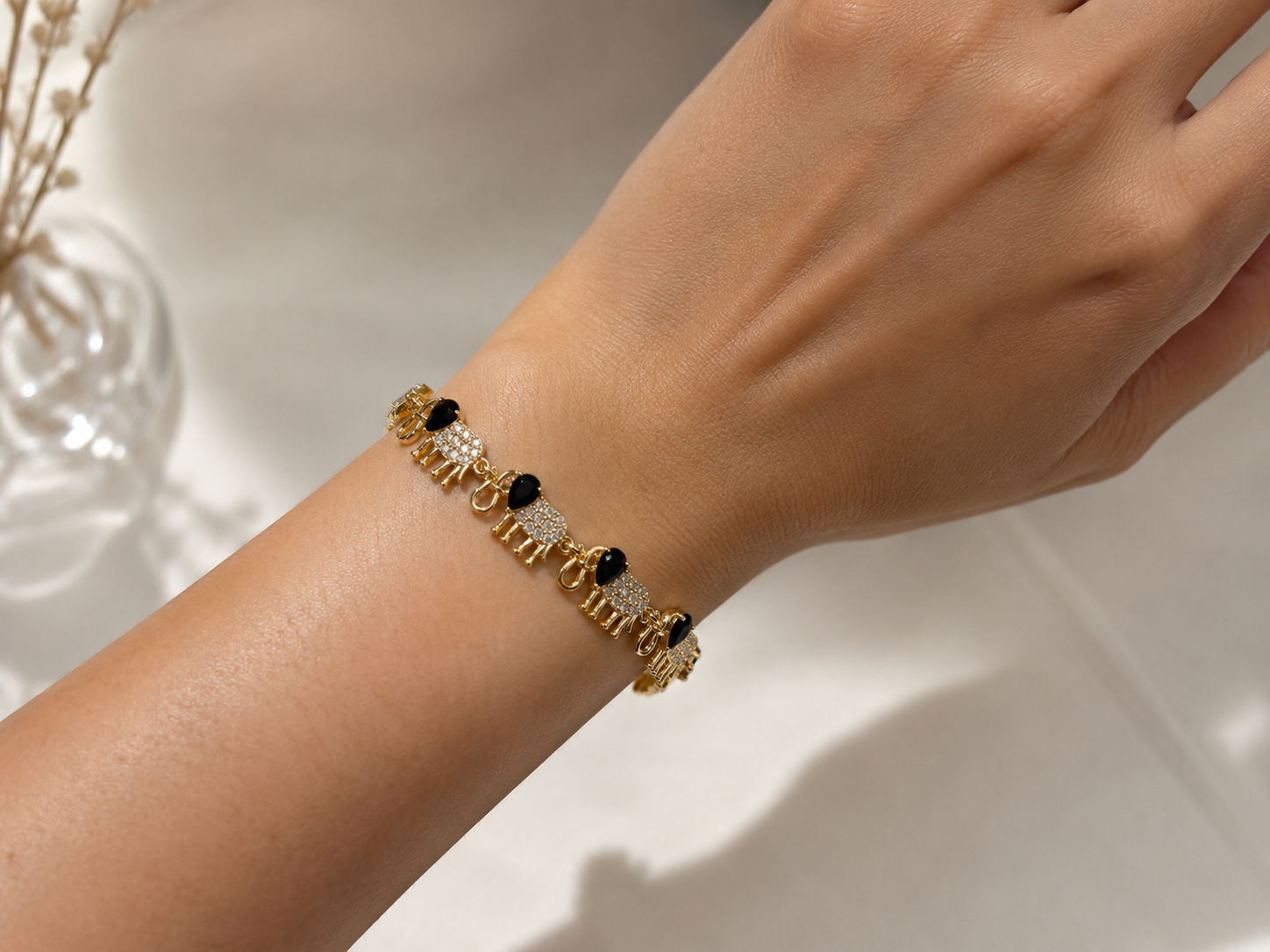 gold plated ladies bracelet with crystal elephants
