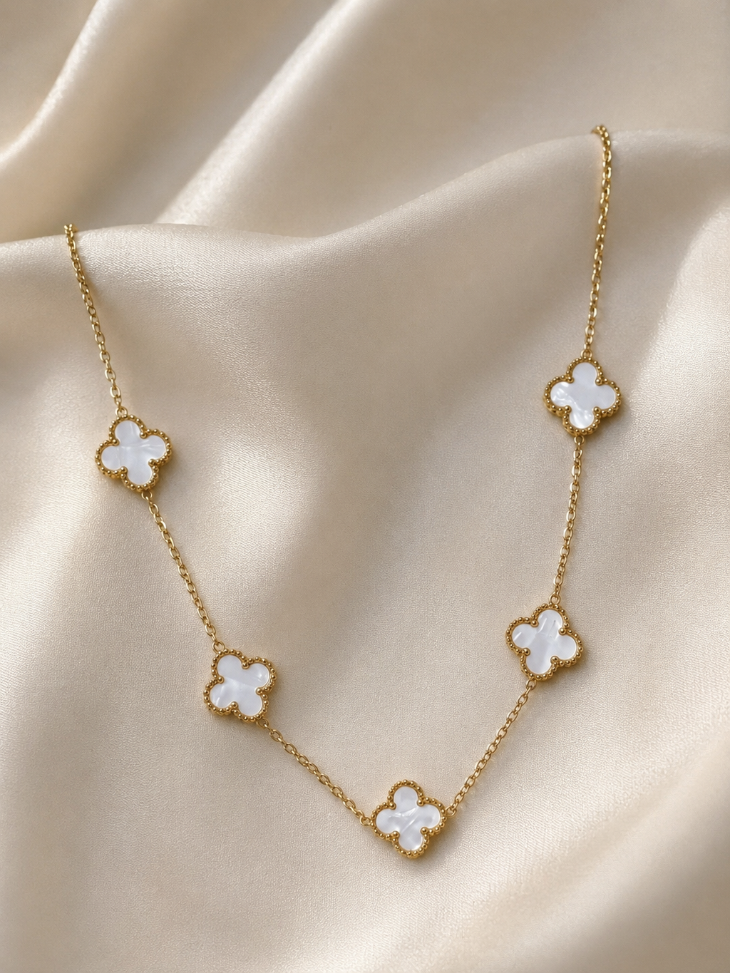 Stainless Steel Necklace Features Five White Clover.