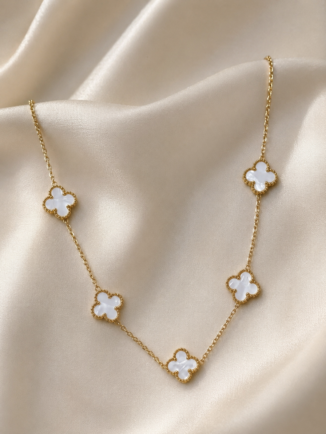 Stainless Steel Necklace Features Five White Clover.