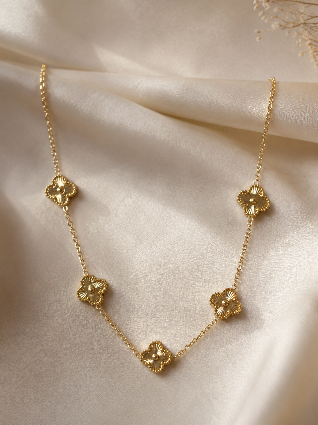 Stainless Steel Necklace Features Five Floral charms