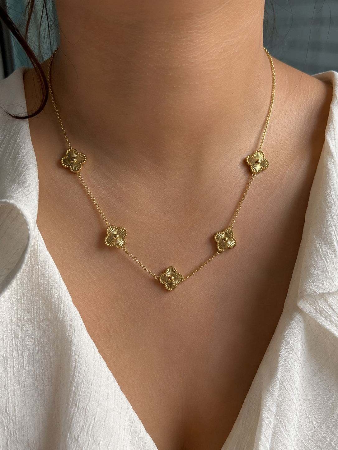 Stainless Steel Necklace Features Five Floral charms