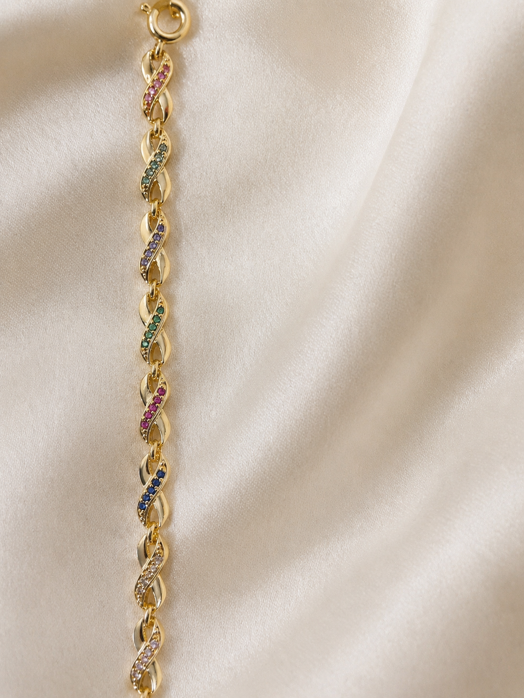 Gold plated multicolor infinity link bracelet for women .